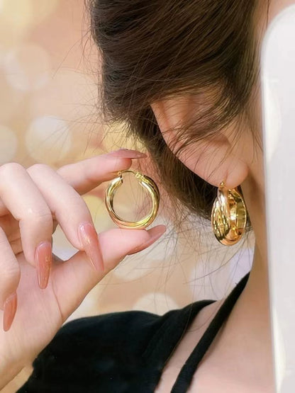 CHXIXUE Jewellery Crossed circular earrings with a unique design that make your face look small